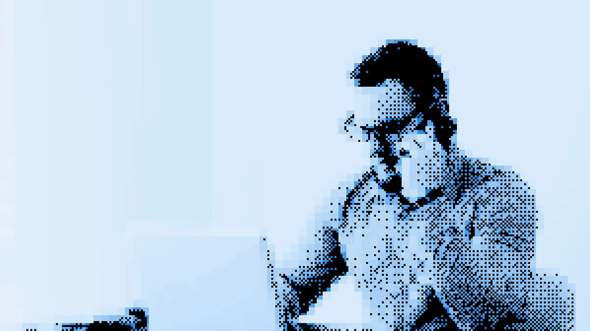 Manager focused on a laptop in a bright meeting room